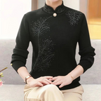 Alfhild black knit sweater with high collar, studded floral pattern, button
