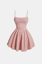 Ruched mini dress with spaghetti straps and flared skirt, blush pink