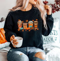 Women’s black crewneck sweatshirt with fall-themed graphic and long sleeves