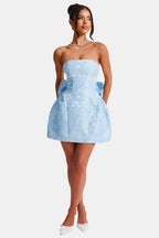 Light blue strapless mini dress with floral jacquard and bow-tie waist detail