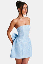 Light blue strapless mini dress with floral jacquard texture and side bow detail