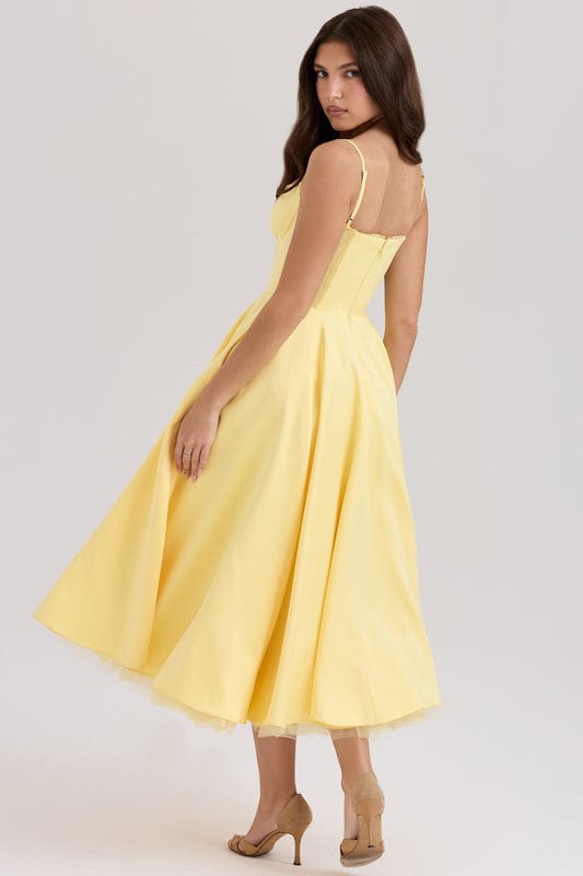 Yellow corset-style sleeveless midi dress with spaghetti straps and full twirled skirt.