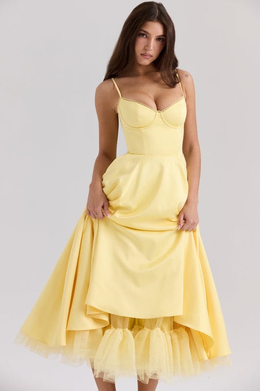 Yellow corset-style sleeveless midi dress with sweetheart neckline and layered tulle hem.