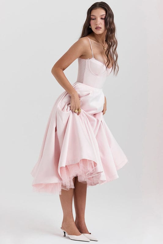 Blush pink corset-style sleeveless midi dress with spaghetti straps and layered flared skirt.