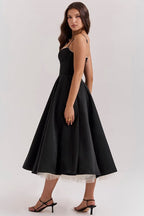Black corset-style sleeveless midi dress with sweetheart neckline and fitted bodice