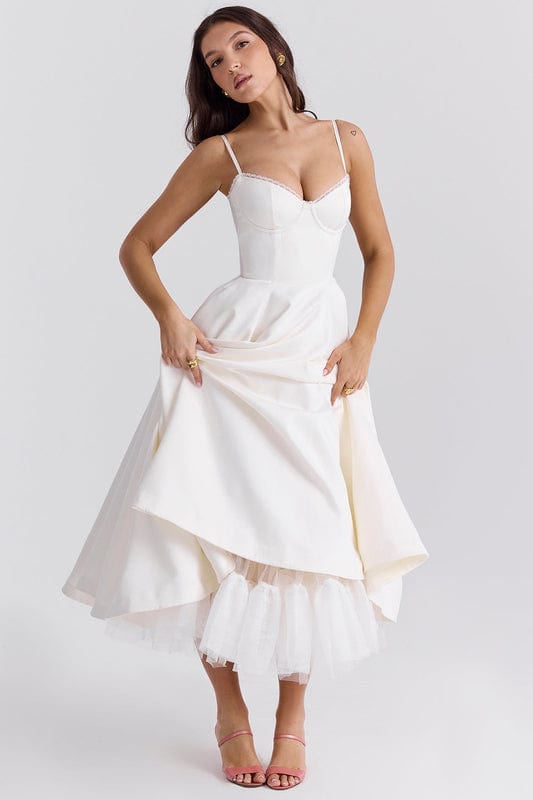 White corset-style sleeveless midi dress with sweetheart neckline and layered flared skirt.