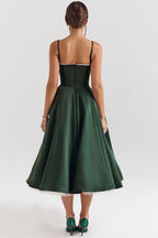Green corset-style sleeveless midi dress with sweetheart neckline and flared skirt.