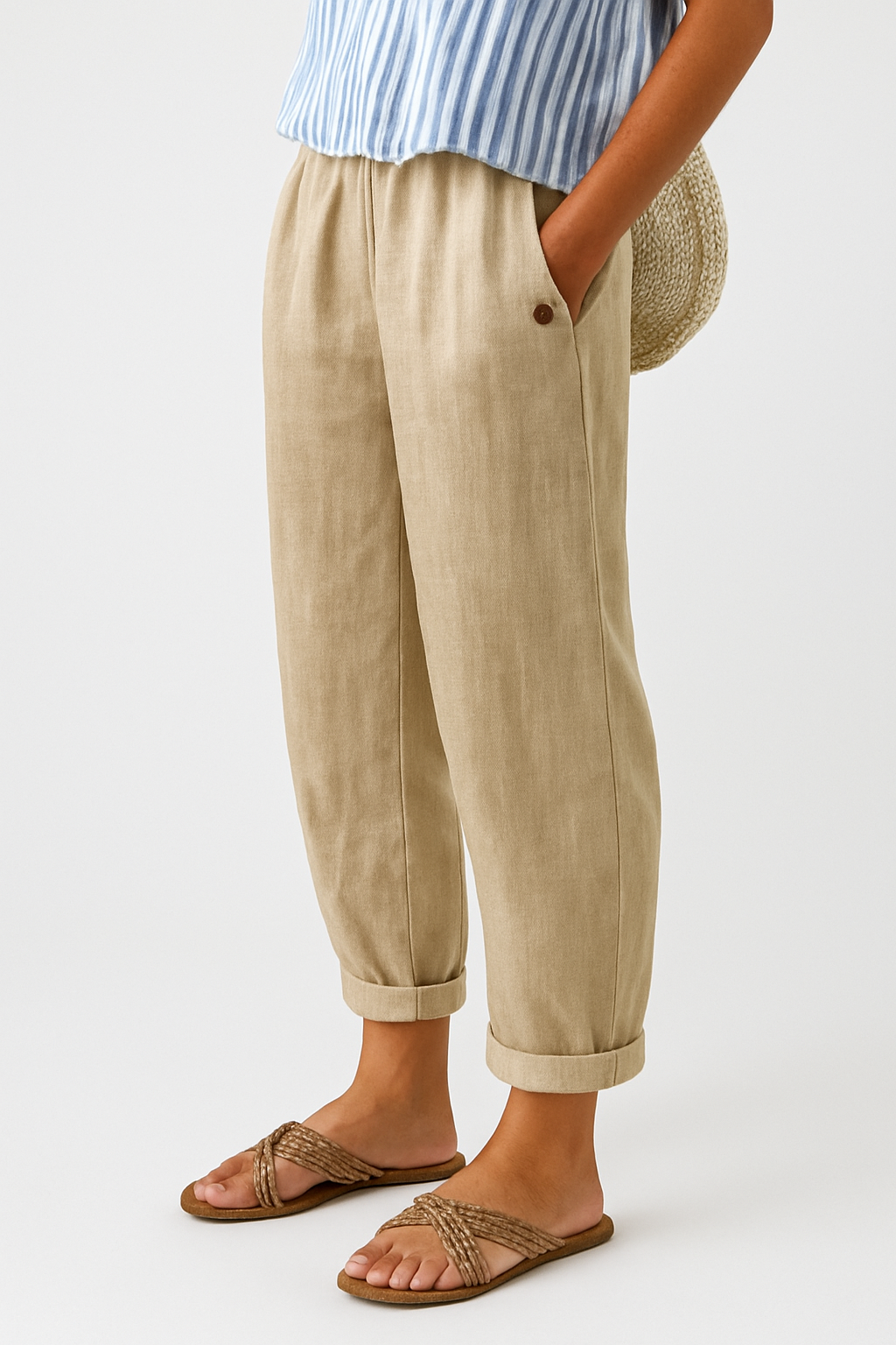 Beige women's pants with elastic waistband, side seam pockets, ankle cuffs