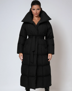 Black long belted puffer coat with hood, quilted panels and front zip