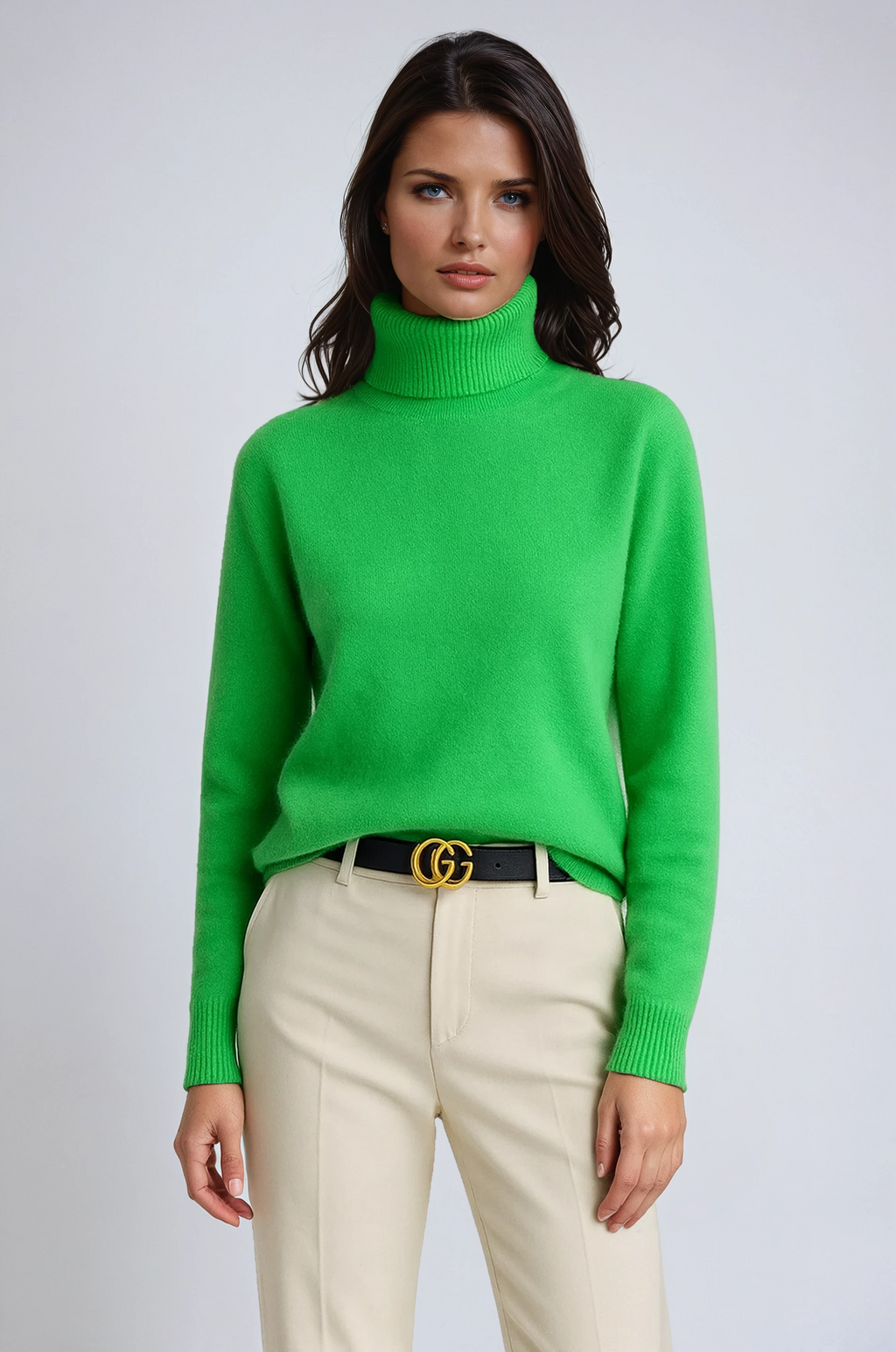 Women’s turtleneck sweater in green knit with high neck and ribbed sleeve cuffs.