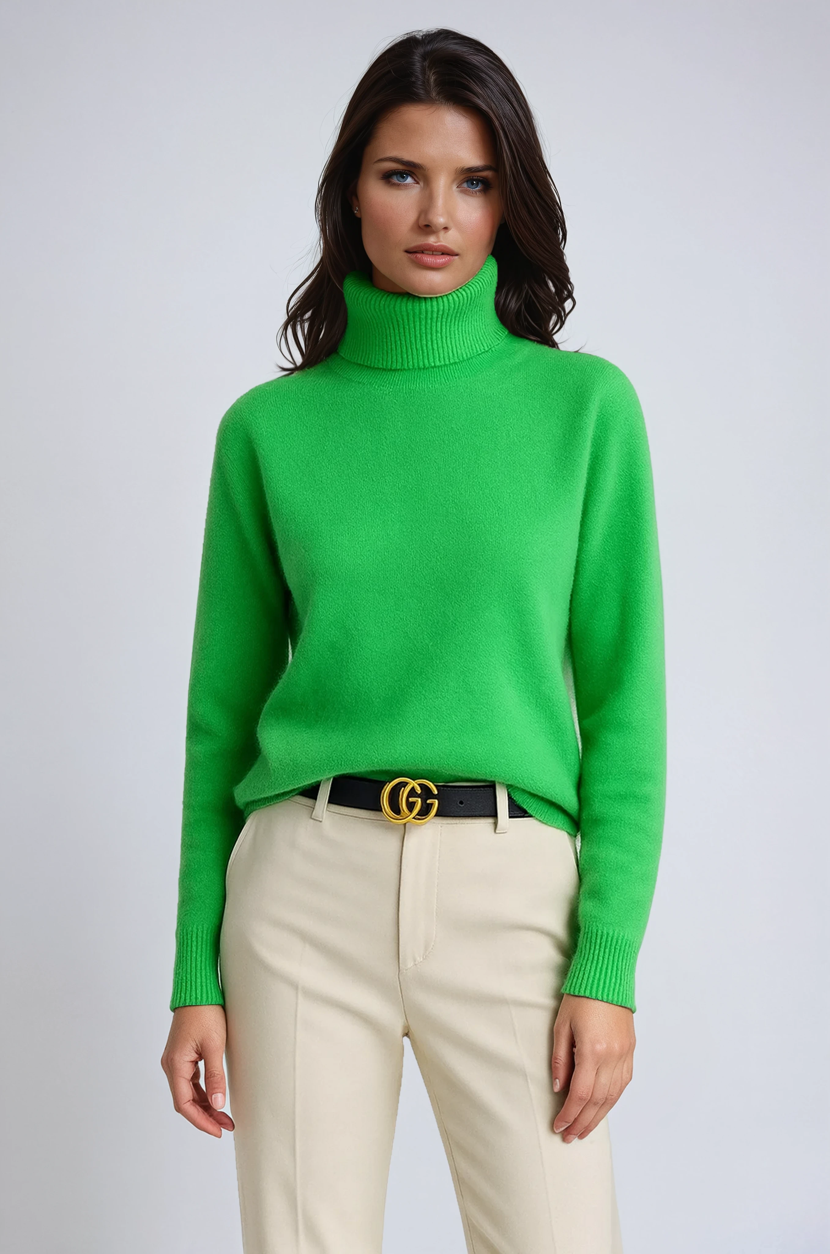 Women’s turtleneck sweater in green knit with high neck and ribbed sleeve cuffs.