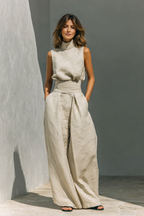 Cream sleeveless top and wide-leg trousers set, wrap-style belted waist