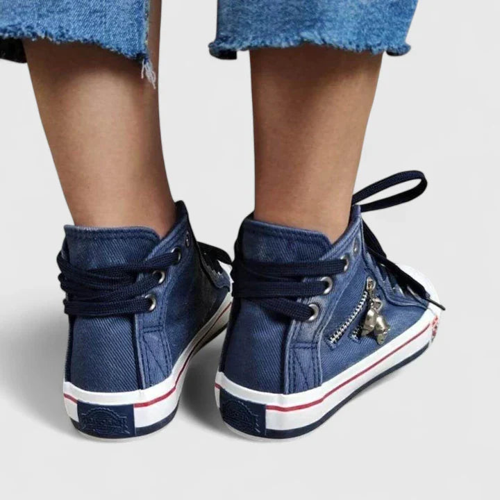 Navy blue denim high-top sneakers with lace-up closure and striped trim on the heel