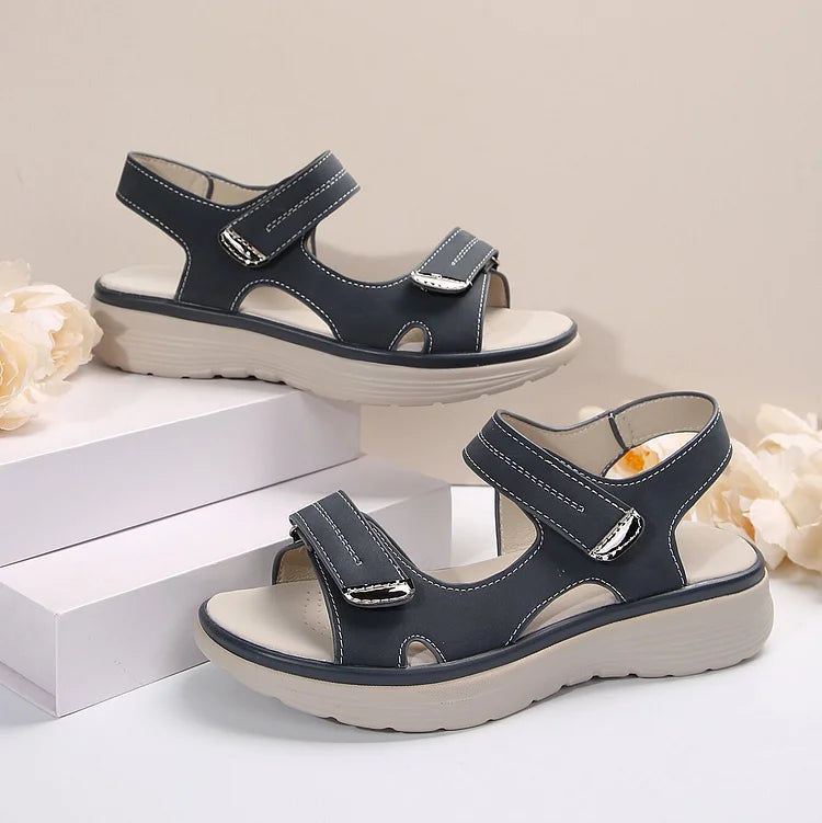 Women’s navy/black sandals with two hook-and-loop straps and sturdy white midsoles