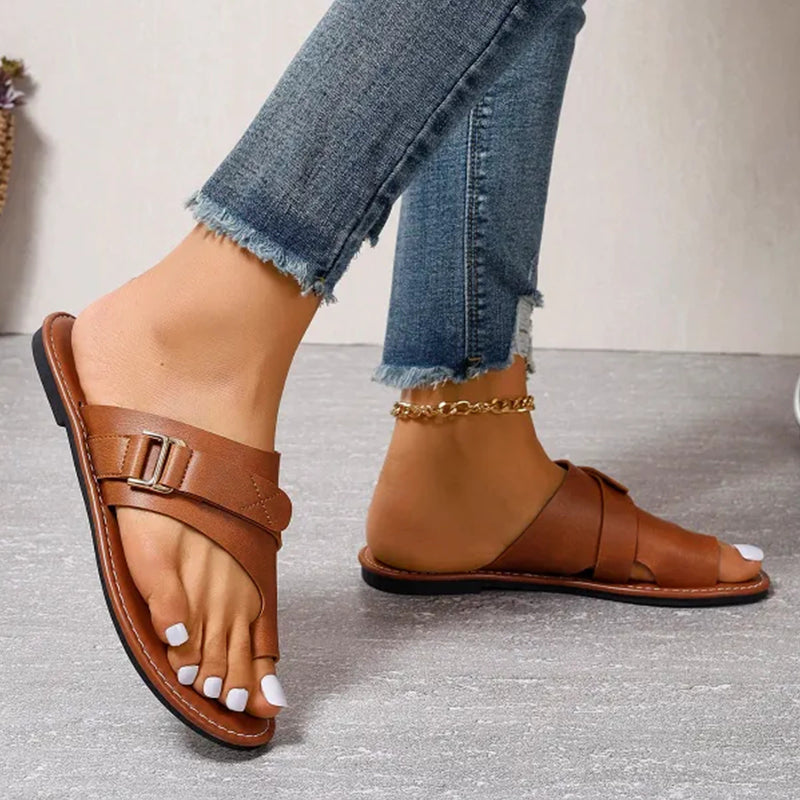 Women’s brown slide sandals with double straps and metal buckle, open toe