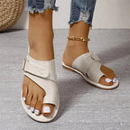 Women’s white slide sandals with two straps and adjustable metal buckle, open toe