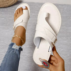 Women’s white sandals with curved straps and metal buckle, open toe design