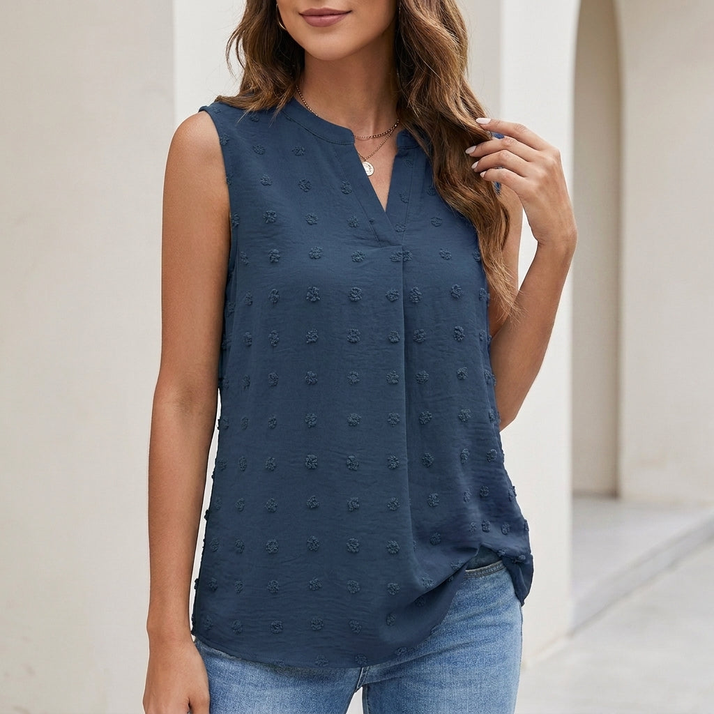 Dark blue sleeveless textured blouse with V-neck and button front
