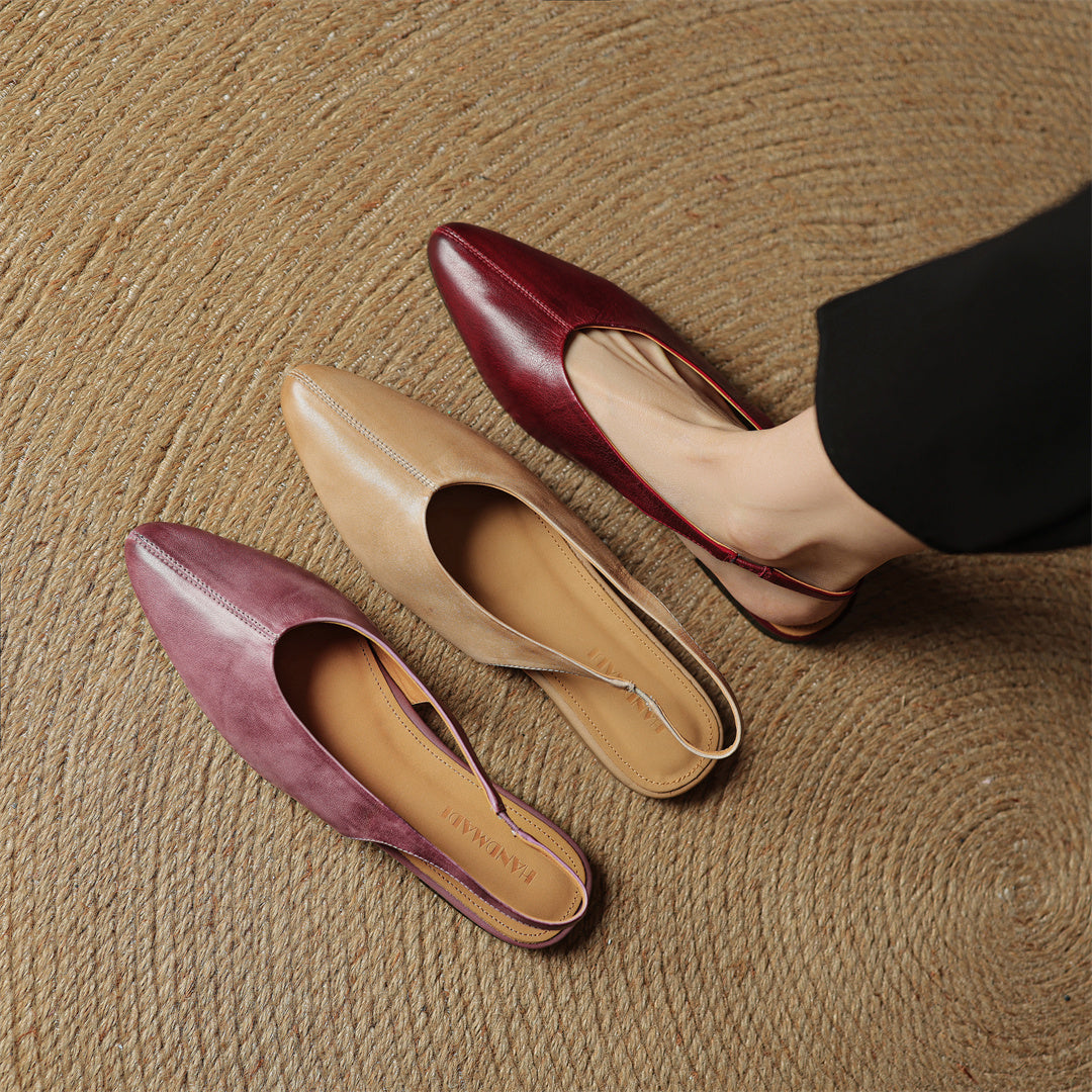 Leather slingback flats in three colors—beige, mauve, and wine red—three pairs on floor