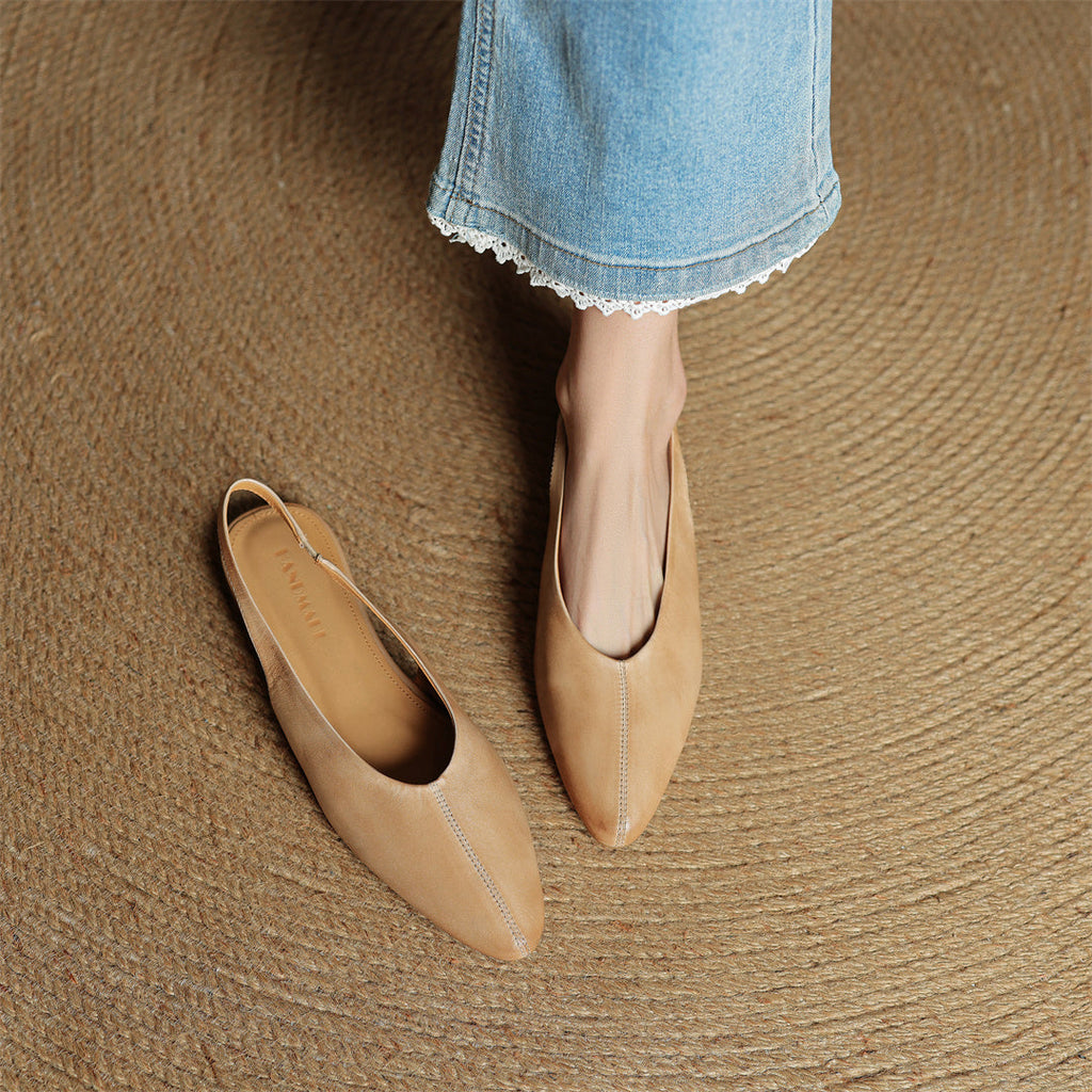 Beige leather slingback flats with pointed toe and cushioned footbed