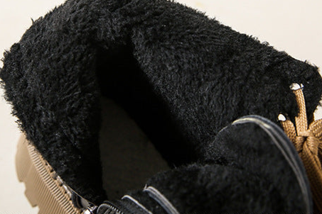 Women's black faux-fur lined boots with lace-up front and thick tread sole