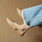 Beige leather slingback flats, pointed toe and low heel with cushioned insole
