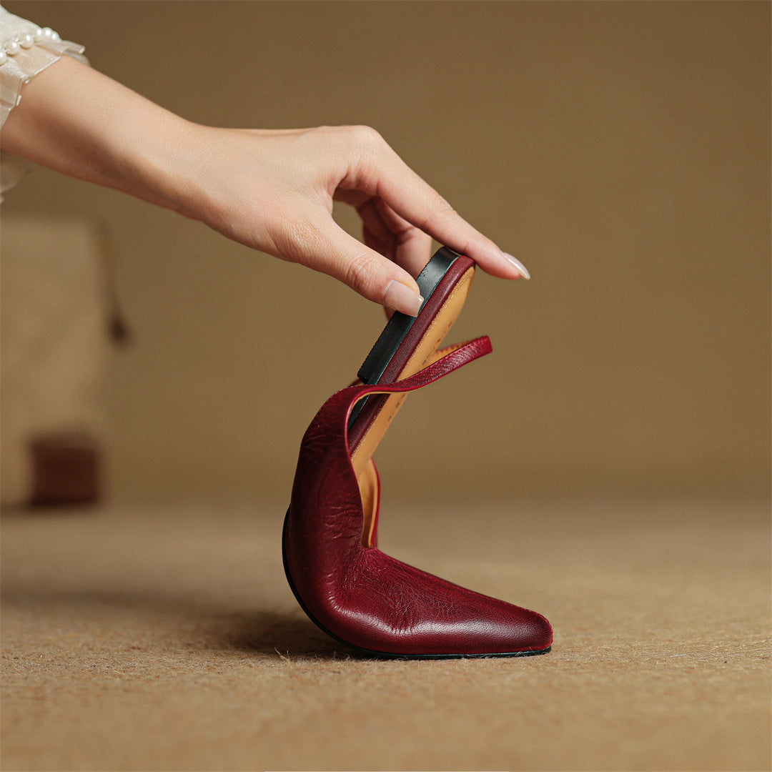 Wine red leather slingback flat with strap and low heel, cushioned footbed