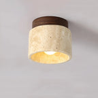 Round flush mount ceiling lamp with travertine stone shade and dark walnut top ring.