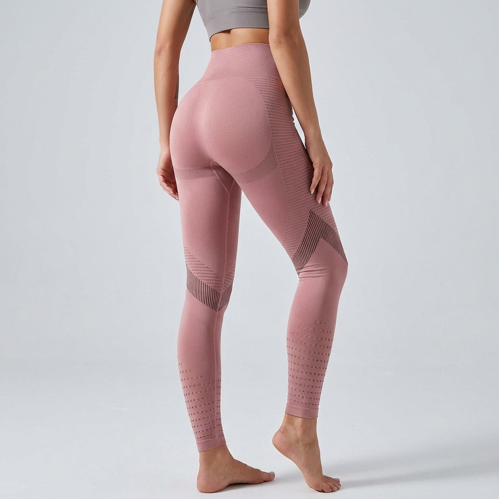 Pink high-waisted leggings with geometric mesh panels and dotted lower-leg design