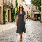 Black and white speckled A-line midi dress with V-neck and short puff sleeves.