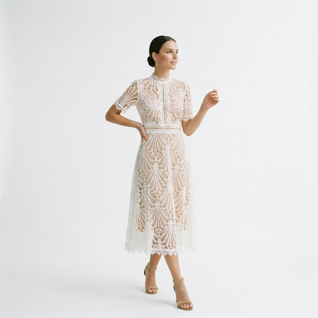 White lace midi dress with short sleeves and decorative floral pattern