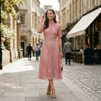 Pink lace midi dress with cap sleeves and floral cutout pattern