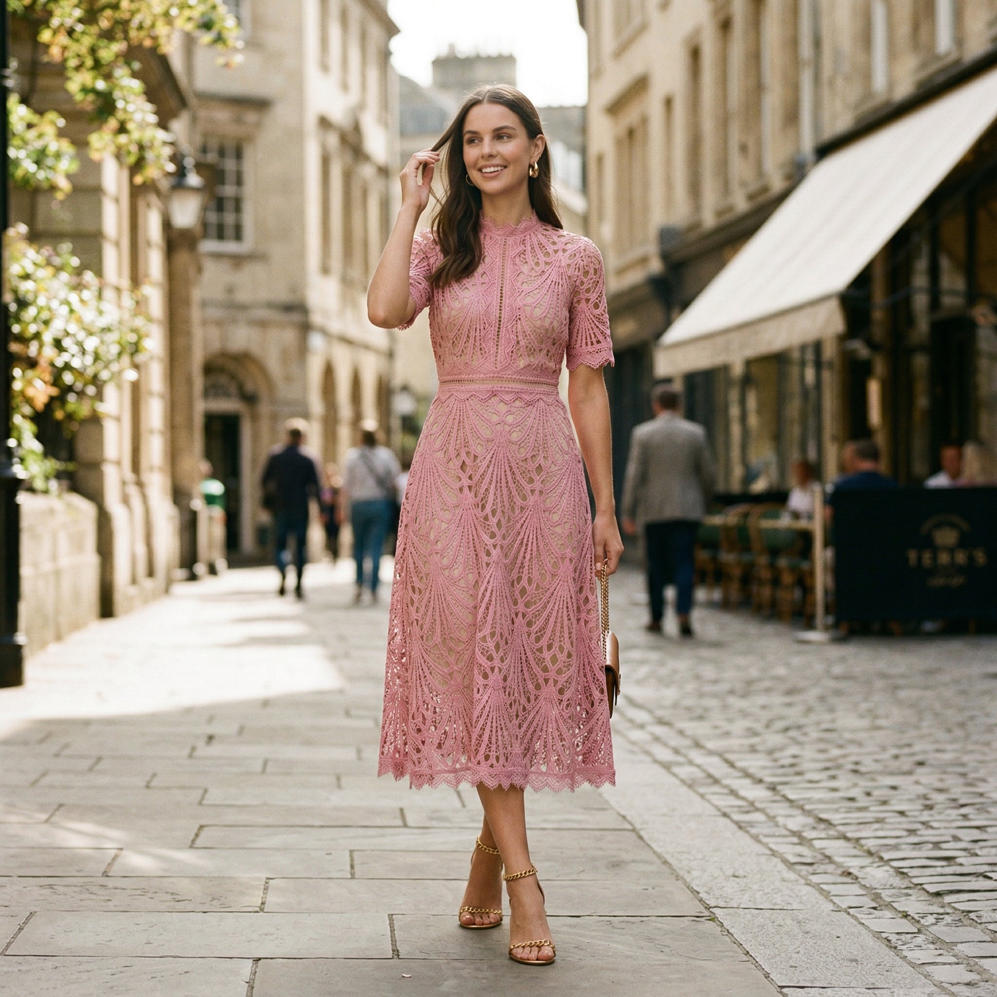Pink lace midi dress with cap sleeves and floral cutout pattern