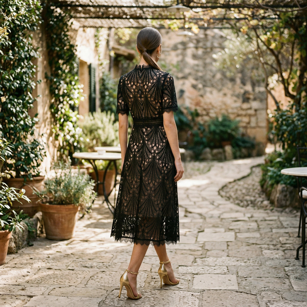 Black lace midi dress with scalloped hem and openwork back