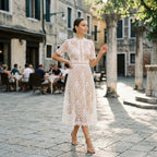 White lace midi dress with high neckline and intricate floral trim