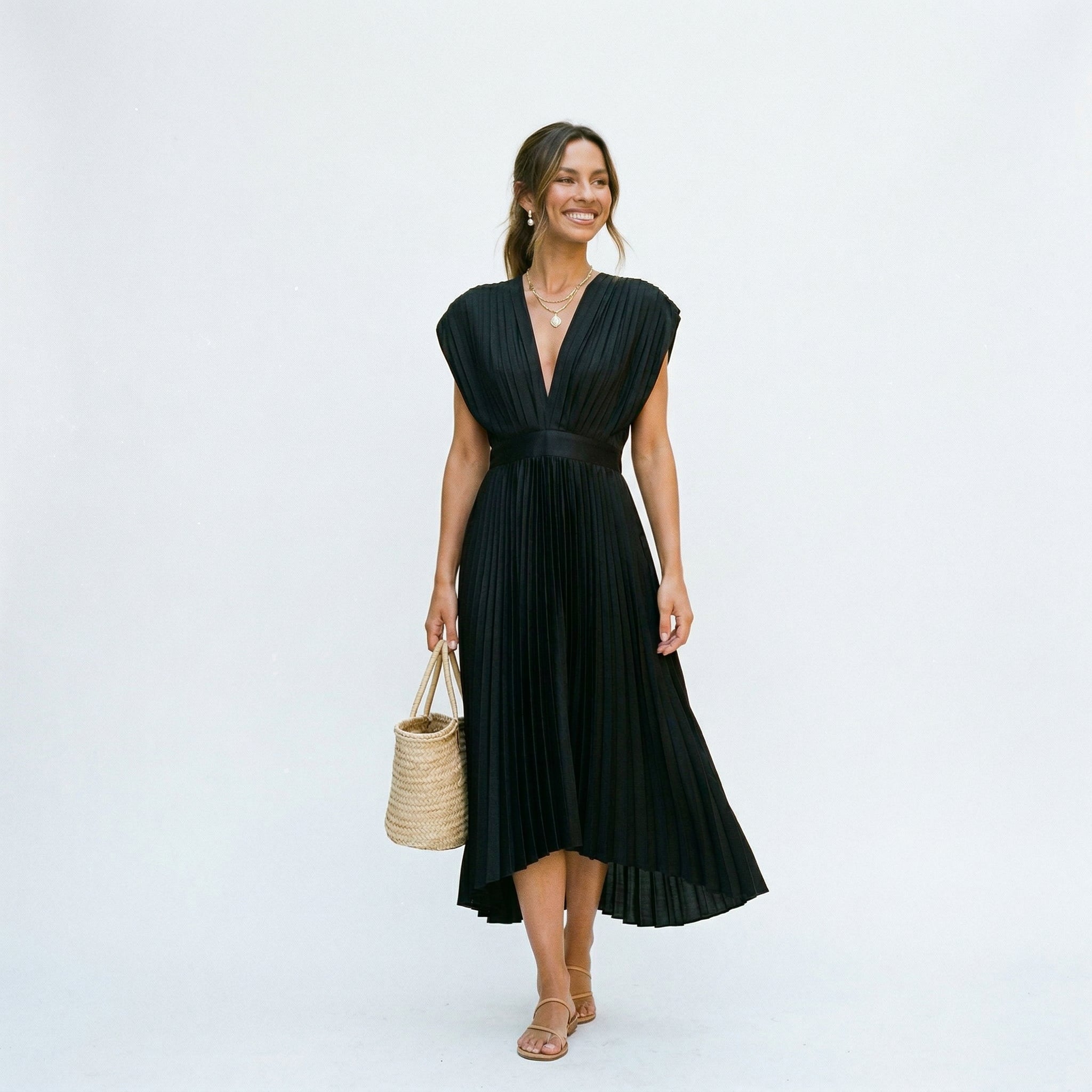 Black pleated V-neck dress with short sleeves and fitted waist, flared mid-calf skirt