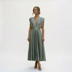 Grey pleated V-neck dress with short sleeves and gathered waist, flared mid-calf skirt