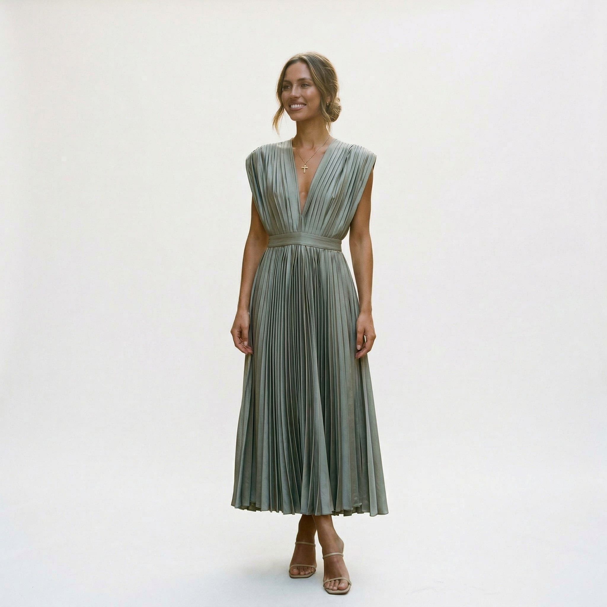 Grey pleated V-neck dress with short sleeves and gathered waist, flared mid-calf skirt