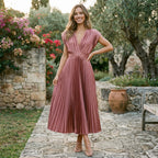 Antique pink pleated V-neck dress with short sleeves and cinched waist, flowing mid-calf hem