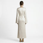 Cream long-sleeve maxi dress, back view with tie waist at the center