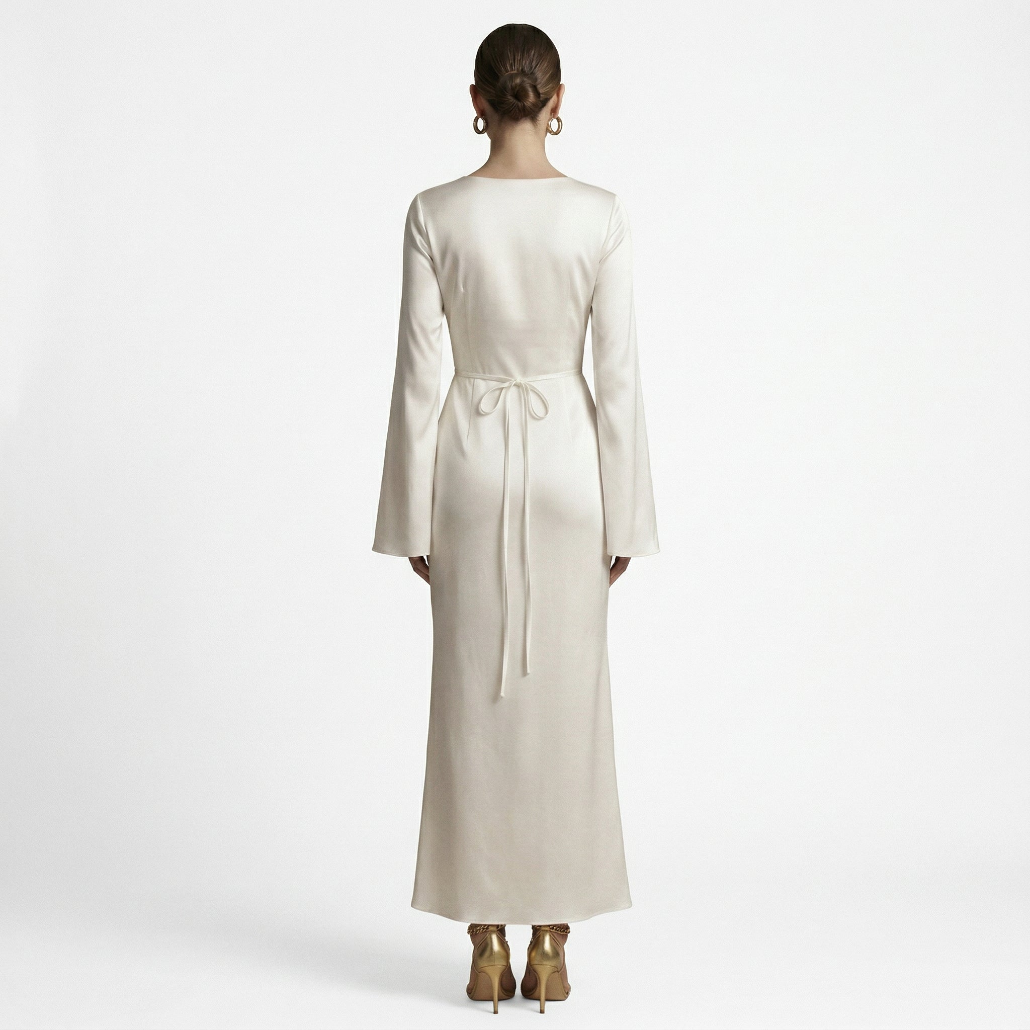 Cream long-sleeve maxi dress, back view with tie waist at the center