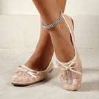 Pink lace mesh ballet flats with bow, round toe, and T-strap cutout