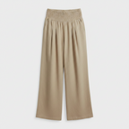 Beige high-waisted linen wide-leg trousers with elastic smocked waistband