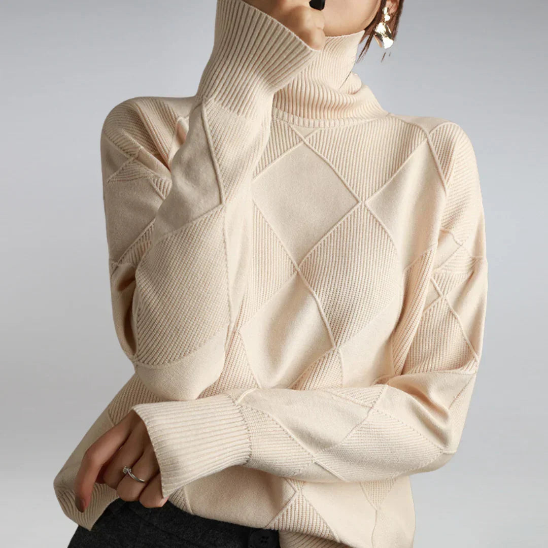Women’s cashmere turtleneck sweater in cream, ribbed collar and diamond knit pattern.