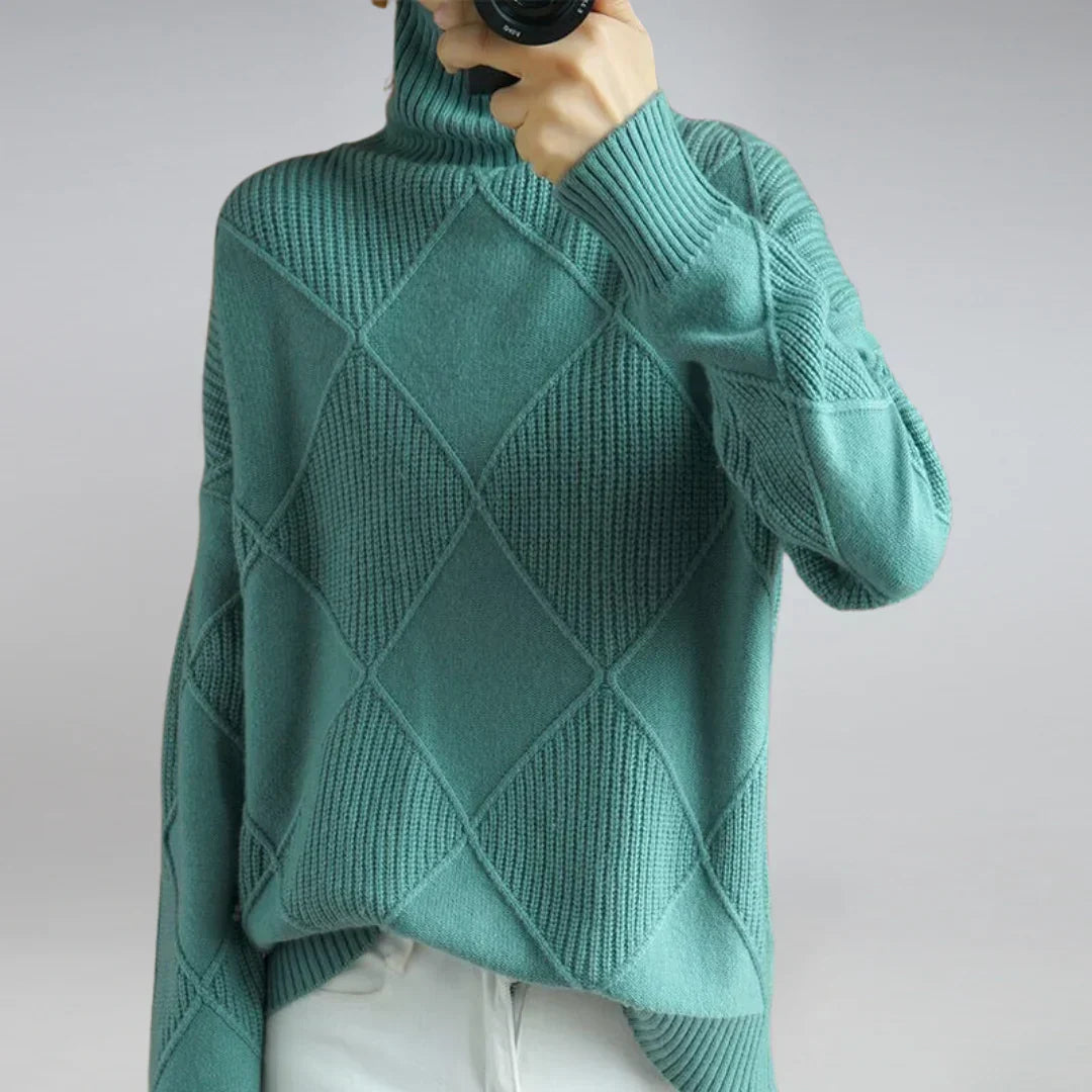 Women’s cashmere turtleneck sweater in teal, ribbed collar and diamond knit texture.