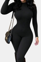 Black long-sleeve crew-neck fitted jumpsuit with visible hip seams and full legs.