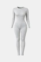 Light grey long-sleeve crew-neck fitted jumpsuit with full-length tapered legs.