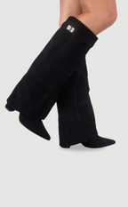 Black knee-high suede boots with wide flare top, block heel, square buckle cuff