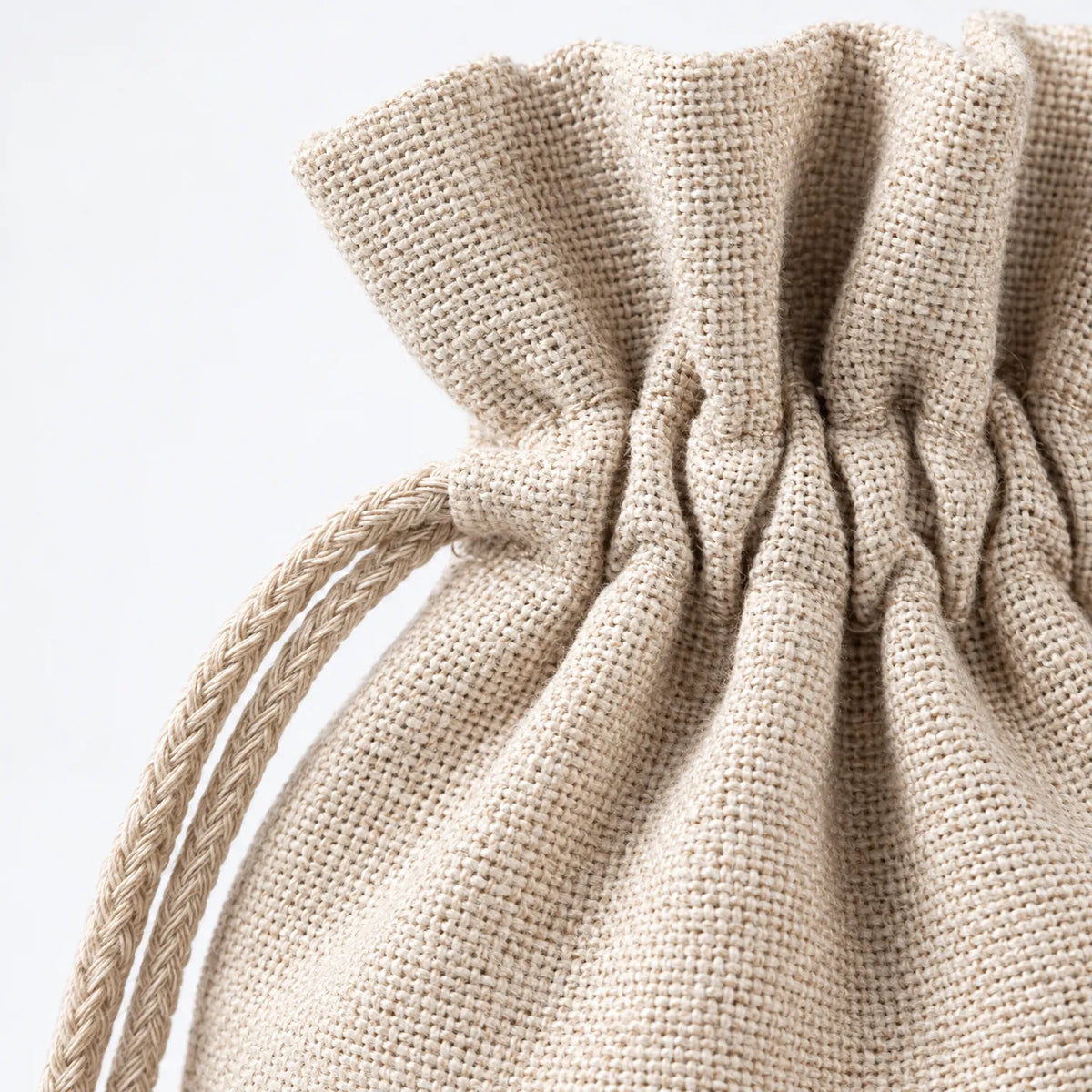 Beige fabric drawstring top on advent calendar bag