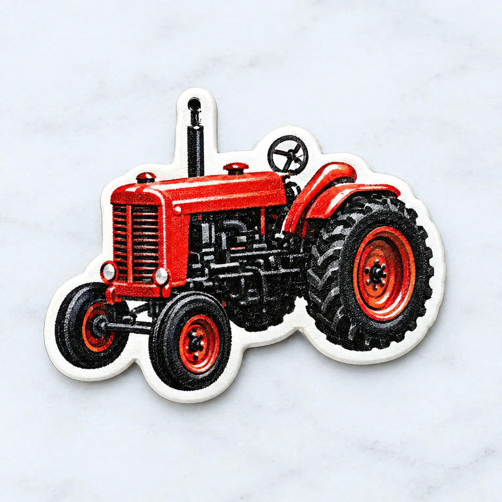 Red and black farm tractor acrylic ornament with hanging loop on white backing